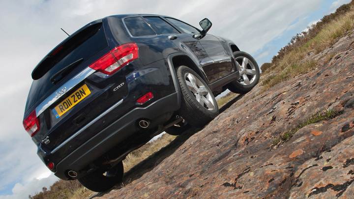 2011 Jeep Grand Cherokee Side N Back Pose in Black